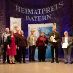 Vertreter einer Musikgruppe bei der Preisverleihung.