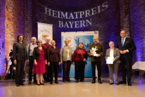 Vertreter einer Musikgruppe bei der Preisverleihung.